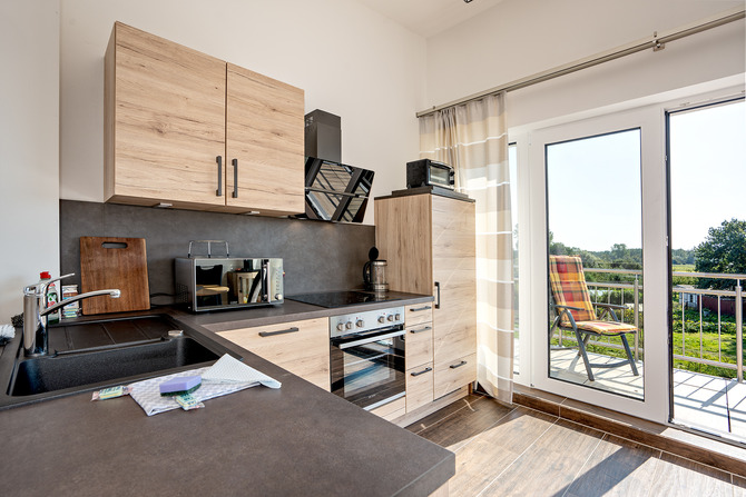 Ferienwohnung in B&ouml;rgerende - Appartement 5 - Traumblick - K&uuml;che mit S&uuml;dbalkon